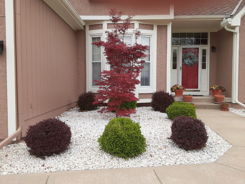 Clean rock landscaping near front entry